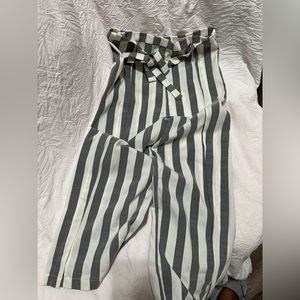 Grey and white plaid pants. With a bow you can put in the front and back.